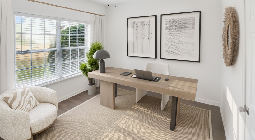 A room with a desk and chair 